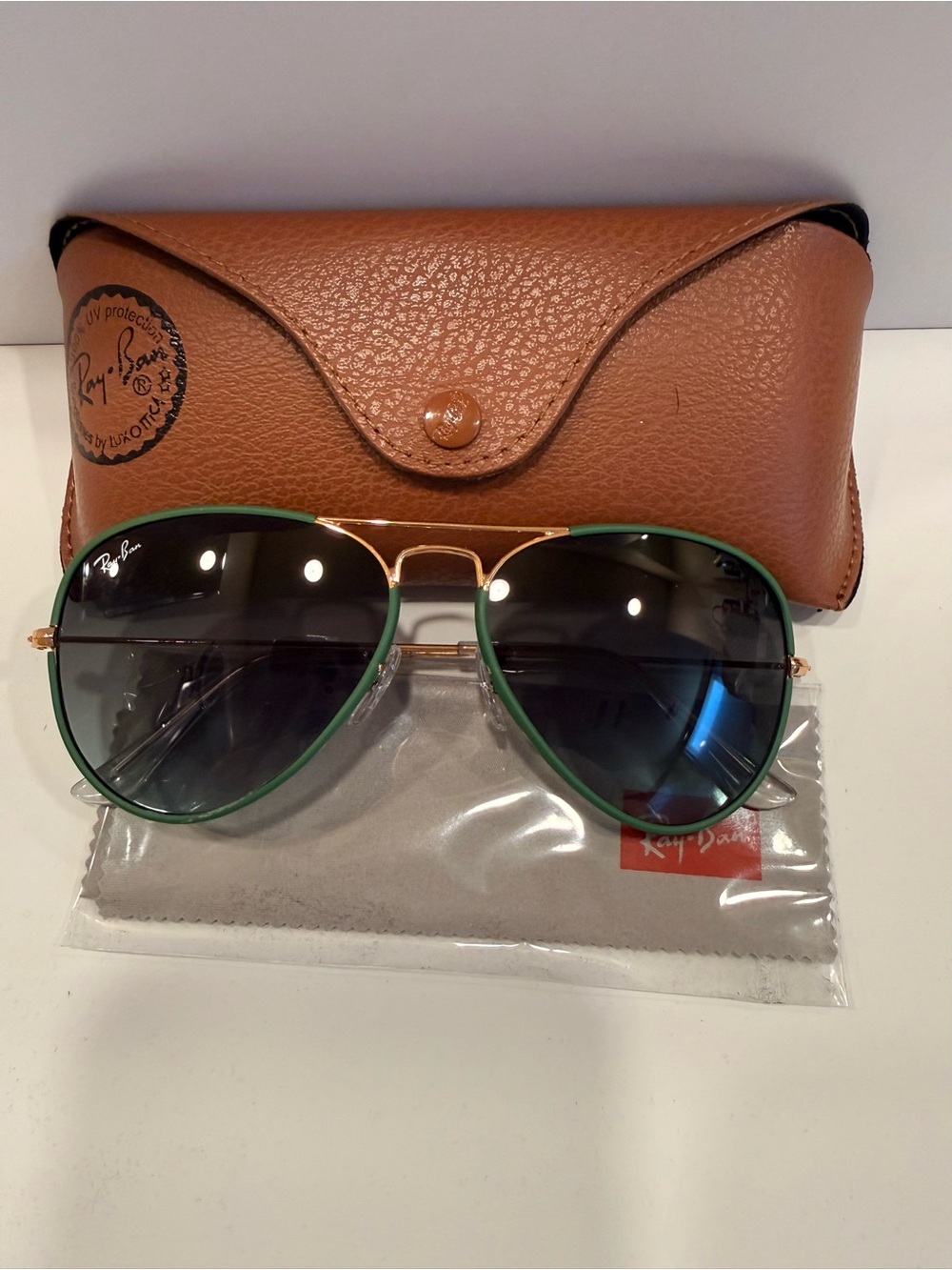 Ray-Ban Gold Frame Aviators with Green Trim and Dark Lenses